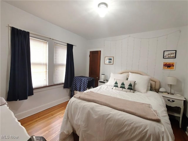 bedroom with wood-type flooring