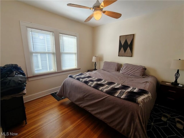 bedroom featuring hardwood / wood-style flooring and ceiling fan