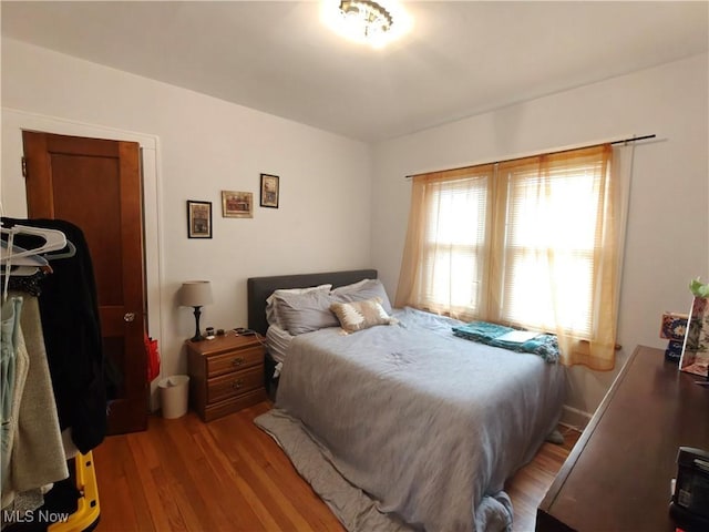 bedroom with light hardwood / wood-style floors