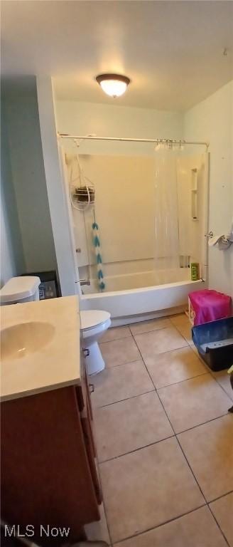 full bathroom featuring shower / bath combo, toilet, tile patterned floors, and vanity