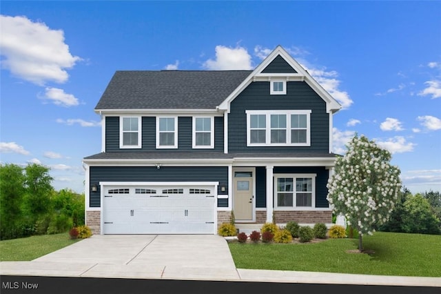 craftsman-style house featuring a garage and a front lawn