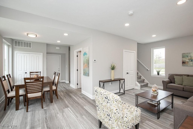 living room with light hardwood / wood-style flooring