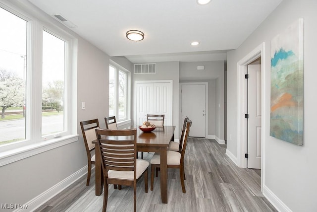 dining space featuring light hardwood / wood-style flooring