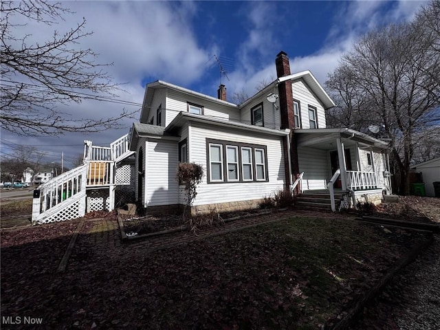 view of property exterior featuring a porch