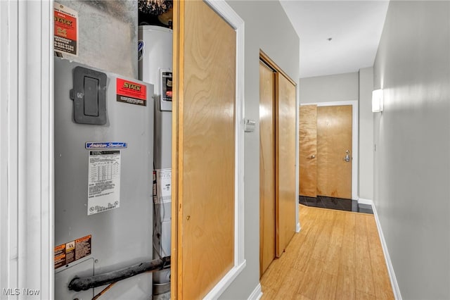 corridor with light hardwood / wood-style flooring