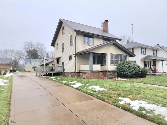 view of property exterior featuring a yard and a deck