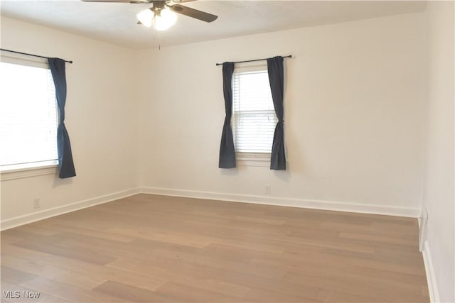 unfurnished room with light hardwood / wood-style floors and ceiling fan