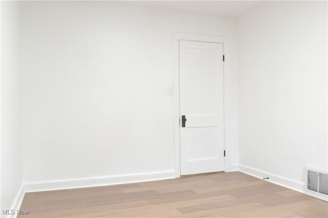 empty room with light hardwood / wood-style floors