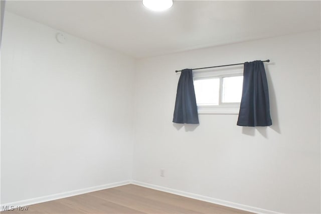 empty room featuring hardwood / wood-style flooring