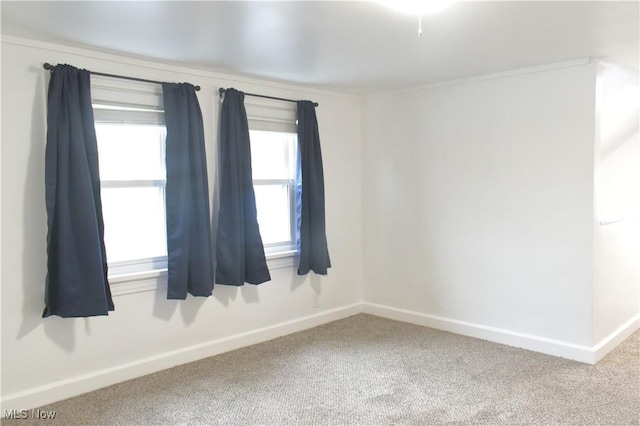 spare room featuring carpet flooring