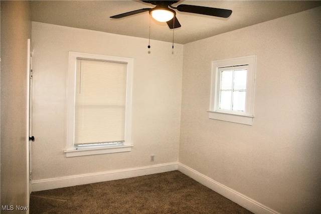 carpeted spare room with ceiling fan