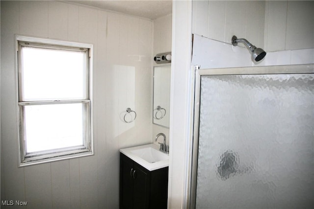 bathroom featuring an enclosed shower and vanity