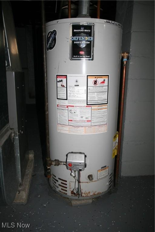 utility room with gas water heater