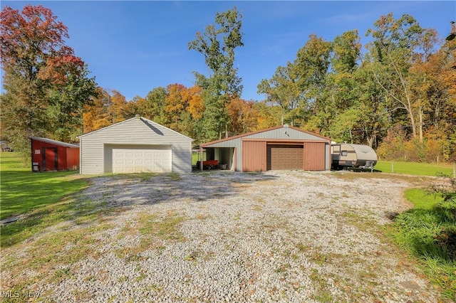 garage featuring a yard