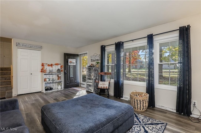 bedroom with dark wood-type flooring and access to outside