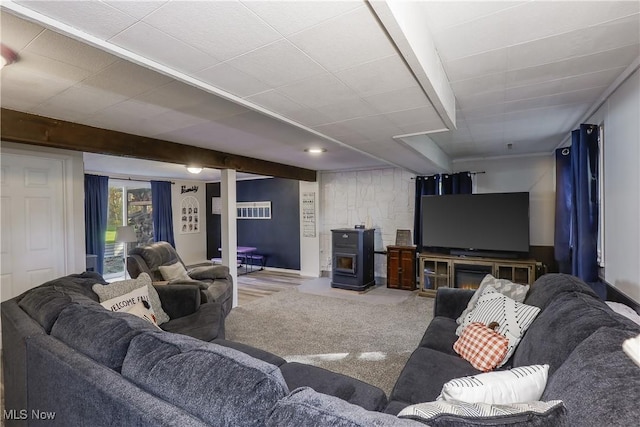 living room with carpet floors and a wood stove