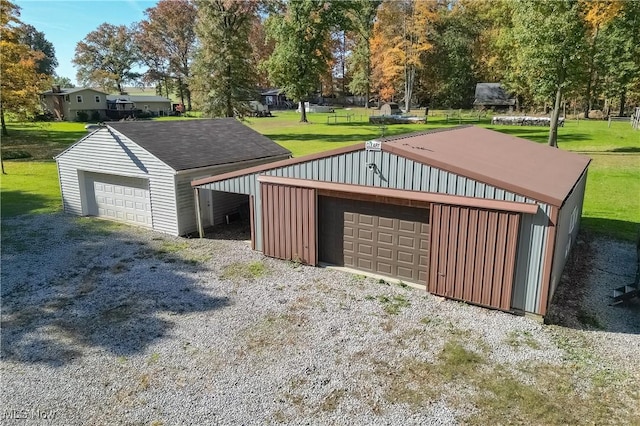 garage featuring a yard