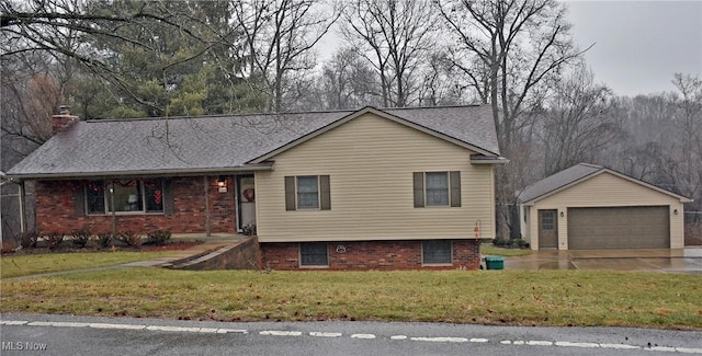 view of front of property with a garage and a front lawn