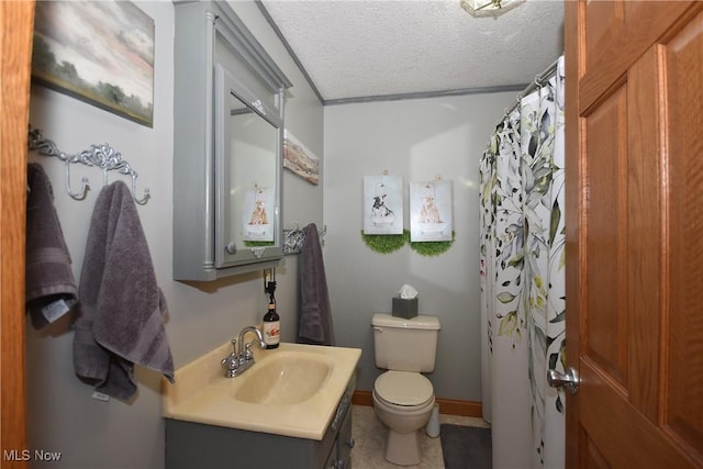 bathroom with vanity, curtained shower, a textured ceiling, and toilet