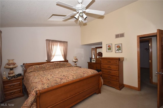 carpeted bedroom featuring ceiling fan, high vaulted ceiling, and a textured ceiling