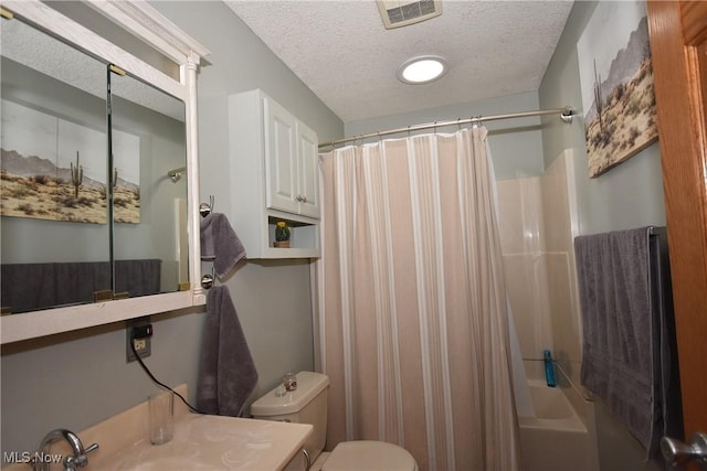 full bathroom featuring shower / bathtub combination with curtain, vanity, toilet, and a textured ceiling