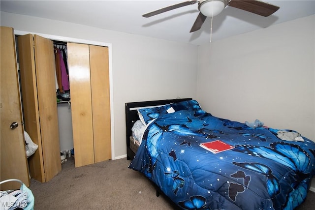 carpeted bedroom featuring ceiling fan and a closet