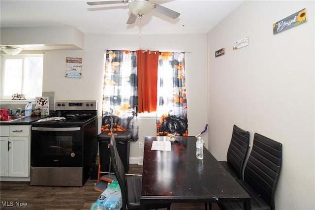 dining area with dark hardwood / wood-style floors and ceiling fan