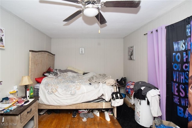 bedroom featuring wood-type flooring and ceiling fan