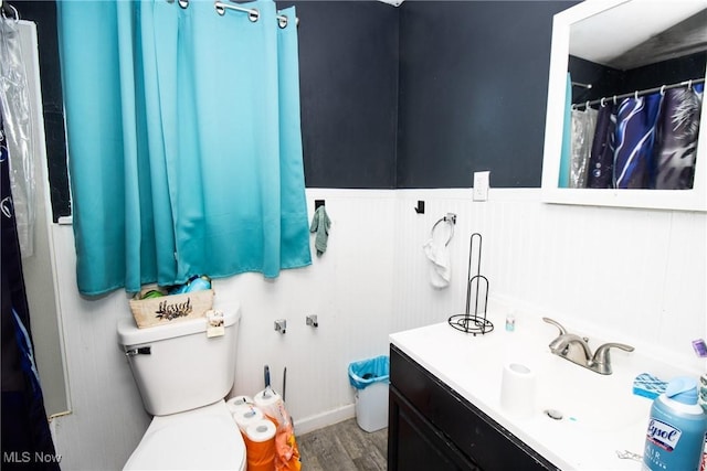 bathroom featuring hardwood / wood-style flooring, vanity, and toilet