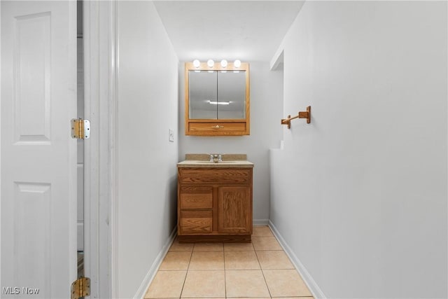 bathroom with vanity and tile patterned flooring