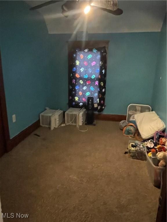 playroom with carpet floors and ceiling fan