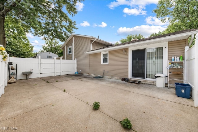 back of property featuring a patio