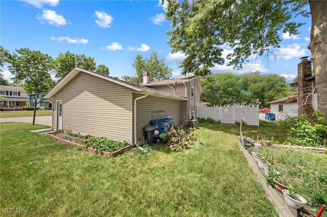 view of home's exterior featuring a yard