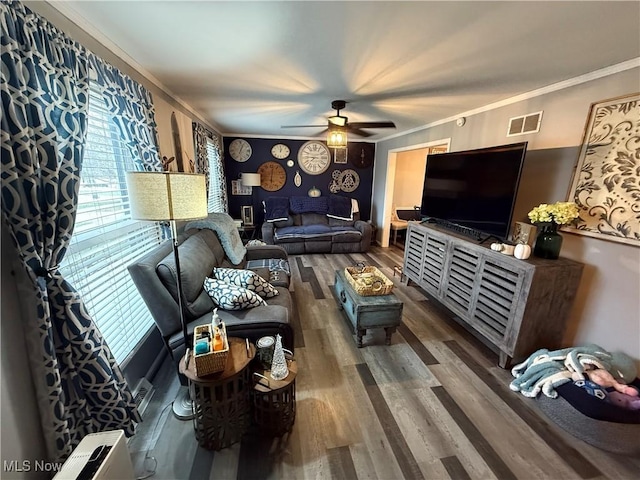 living room featuring crown molding, dark hardwood / wood-style floors, and ceiling fan