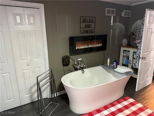 bathroom featuring a bathtub and hardwood / wood-style flooring