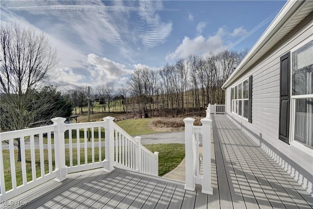 deck with a yard and central air condition unit