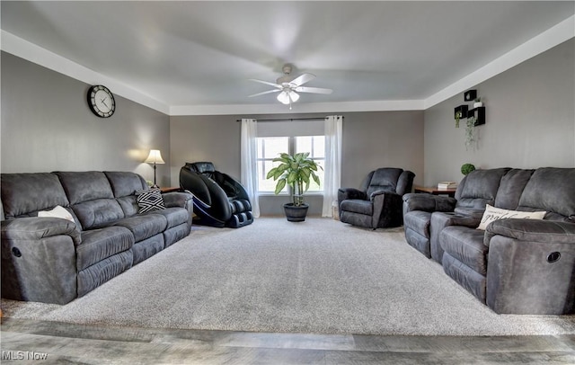 carpeted living room featuring ceiling fan