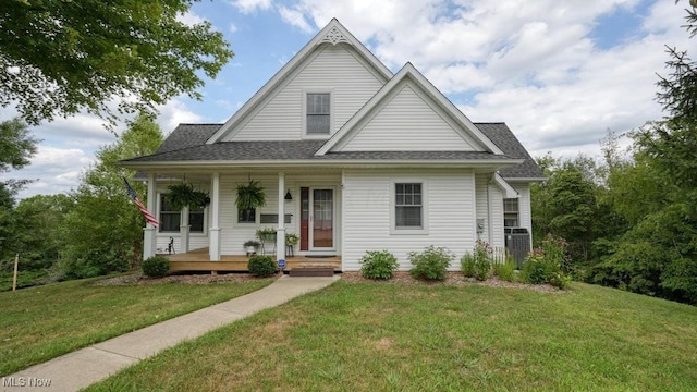 view of front of house with a porch and a front yard