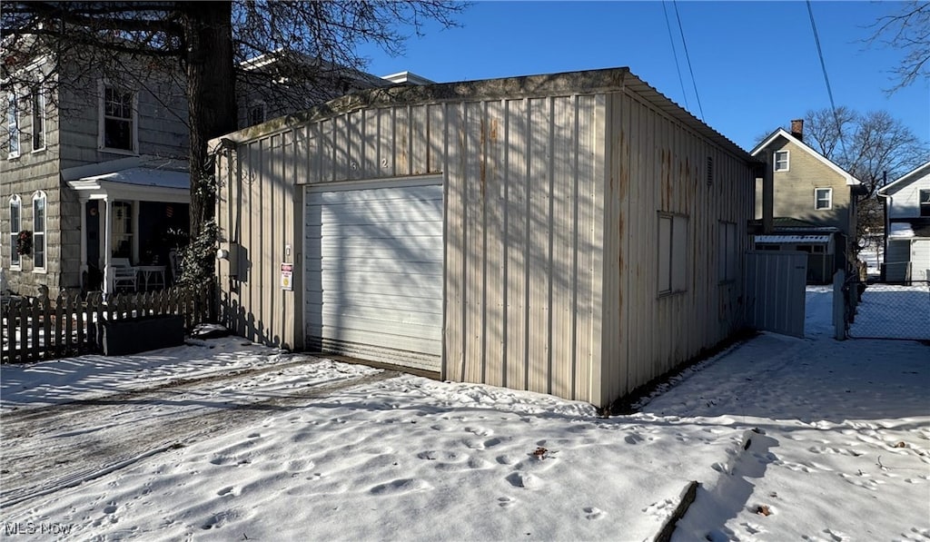 view of snow covered garage