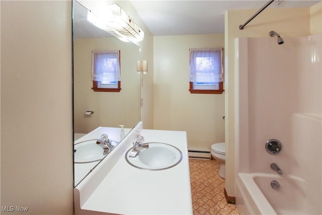 full bathroom with shower / bathing tub combination, vanity, toilet, and baseboard heating