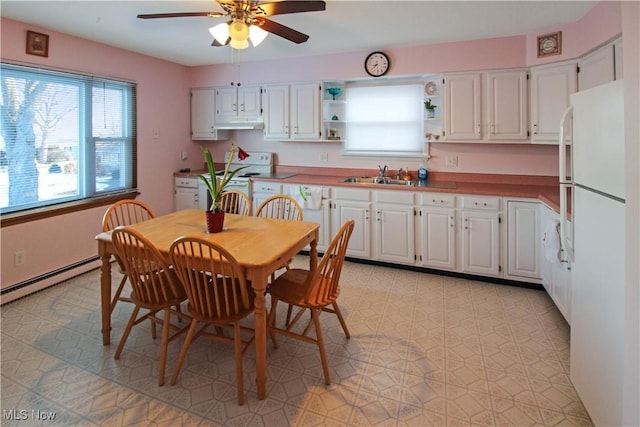 kitchen featuring white cabinetry, white appliances, and sink