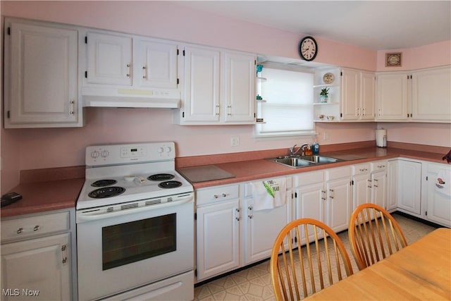 kitchen featuring sink, white appliances, and white cabinets