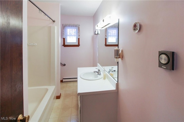 bathroom with tile patterned flooring, vanity, a baseboard heating unit, and  shower combination