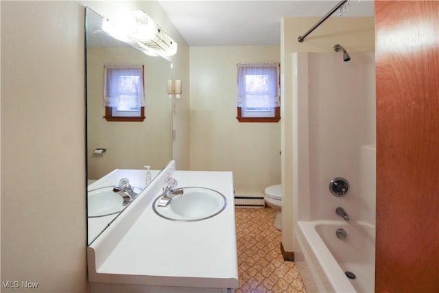 full bathroom with vanity, tub / shower combination, a baseboard heating unit, and toilet