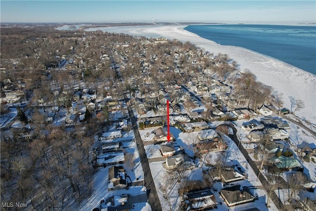 bird's eye view with a water view and a beach view