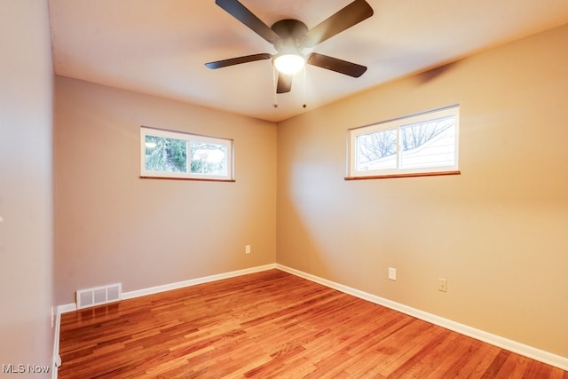 spare room with ceiling fan and light hardwood / wood-style flooring