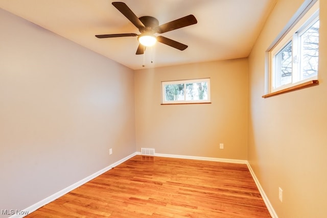 unfurnished room with ceiling fan and light hardwood / wood-style floors