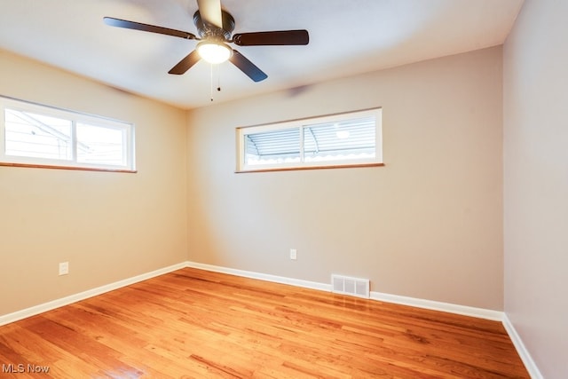 spare room featuring ceiling fan and light wood-type flooring