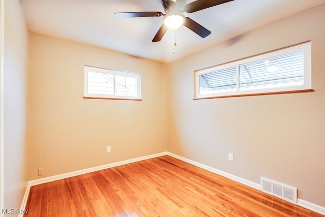 unfurnished room featuring ceiling fan and light hardwood / wood-style floors