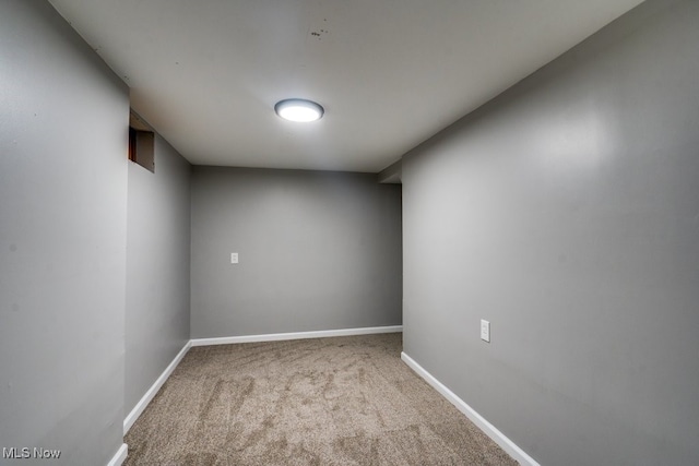 empty room featuring light colored carpet